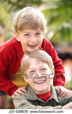 Stock Photograph - Joshua, Portrait, Yanik, Grinning, Looking at camera. Fotosearch