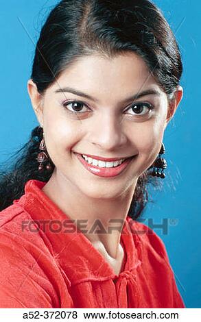 Stock Photo - Joyful South Asian lady looking at you.. Fotosearch