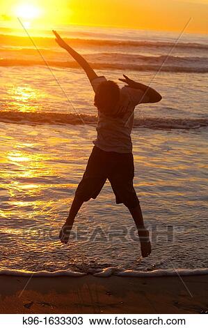 Jumping at Sunset View Large Photo Image Stock Image - Jumping at Sunset. Fotosearch