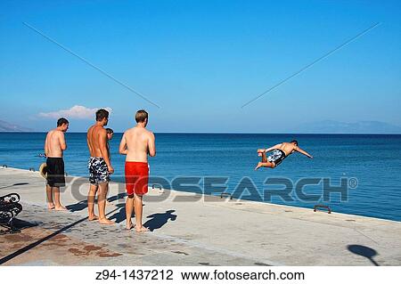 Jumping into the water View Large Photo Image Stock Image - Jumping into the water. Fotosearch