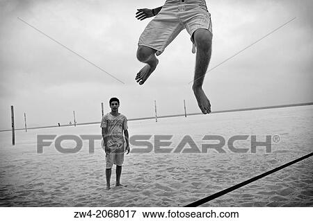 Jumping on the rope in Copacabana beach. View Large Photo Image Stock Photo - Jumping on the rope in Copacabana beach.. Fotosearch