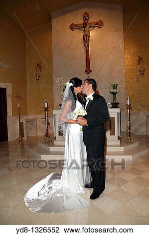 Just Married kissing in the Church View Large Photo Image Stock Image - Just Married kissing in the Church. Fotosearch