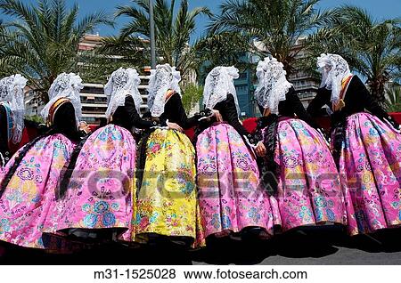 Juvenile fogueres beauties with traditional attire at Hogueras de San Juan, Fogueres de Sant Joan festival Alicante City, Costa Blanca, Spain, Europe View Large Photo Image Stock Photo - Juvenile fogueres beauties with traditional attire at Hogueras de San Juan, Fogueres de Sant Joan festival Alicante City, Costa Blanca, Spain, Europe. Fotosearch