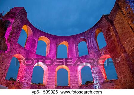 Stock Photograph - Kaiserthermen, World Heritage Site, illuminated at night, Trier, Germany. Fotosearch