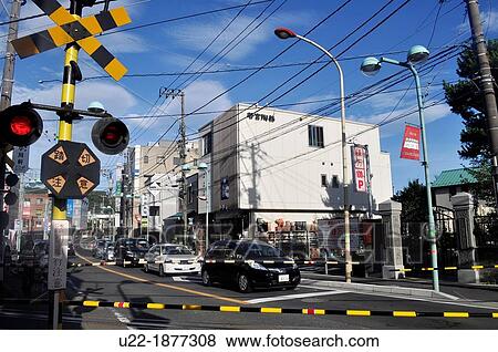 Stock Photo - Kamakura, Kanagawa, Japan, view of the city by a grade crossing. Fotosearch