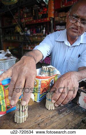 Kandy Sri Lanka: a tobacco shop owner selling beedies View Large Photo Image Picture - Kandy Sri Lanka: a tobacco shop owner selling beedies. Fotosearch