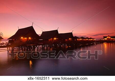 Stock Image - Kapalai resort at Kapalai Island at sunset, Borneo, Malaysia. Fotosearch