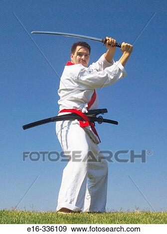 Stock Photo - karate man with sword. Fotosearch