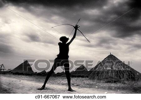 Karo boy with bow. South Ethiopia. African people View Large Photo Image Stock Photo - Karo boy with bow. South Ethiopia. African people. Fotosearch