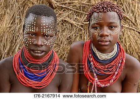 Karo girls with face paint in Kolcho on the Omo River, Ethiopia. View Large Photo Image Picture - Karo girls with face paint in Kolcho on the Omo River, Ethiopia.. Fotosearch