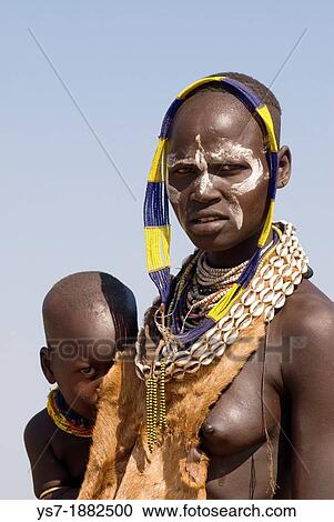 Stock Image - Karo mother and child portrait, Omo river, Ethiopia, Africa. Fotosearch