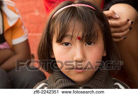 Kathmandu Nepal Nepali child age 9 posing for camera Nayapati, Eastern Kathmandu 1. View Large Photo Image Stock Image - Kathmandu Nepal Nepali child age 9 posing for camera Nayapati, Eastern Kathmandu 1.. Fotosearch