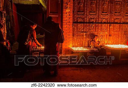 Kathmandu Nepal selling lighting butter candles to be lit for prayers in the early morning at the Boudhanath Stupa Buddhism 8 9. View Large Photo Image Stock Image - Kathmandu Nepal selling lighting butter candles to be lit for prayers in the early morning at the Boudhanath Stupa Buddhism 8 9.. Fotosearch