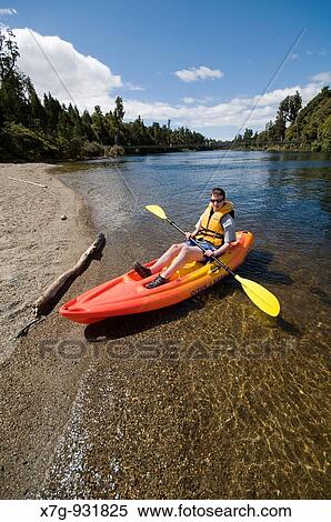 Kayaking in the Arnold River outlet at Lake Brunner, New Zealand View Large Photo Image Stock Photography - Kayaking in the Arnold River outlet at Lake Brunner, New Zealand. Fotosearch
