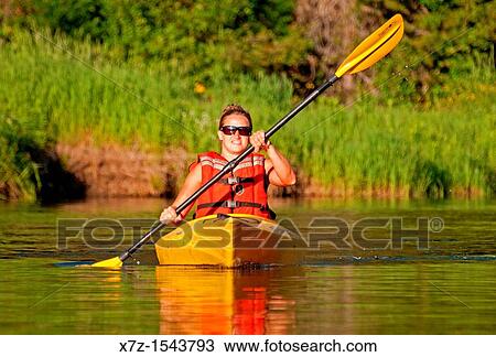 Stock Image - Kayaking on the North Fork of the Payette River near Payette Lake and the city of McCall in the Salmon River Mountains of central Idaho. Fotosearch
