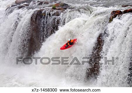Stock Image - Kayaking Star Falls which is rated Class 6 on the Murtaugh section of The Snake River near the town of Murtaugh in southern Idaho. Fotosearch