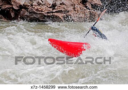 Stock Photo - Kayaking The Drop which is rated Class 5 on the Milner section of The Snake River near the town of Murtaugh in southern Idaho. Fotosearch