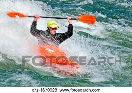 Stock Photo - Kayaking The Wave a rapid which is rated Class 4 on The Snake River near the town of Hagerman in southern Idaho. Fotosearch
