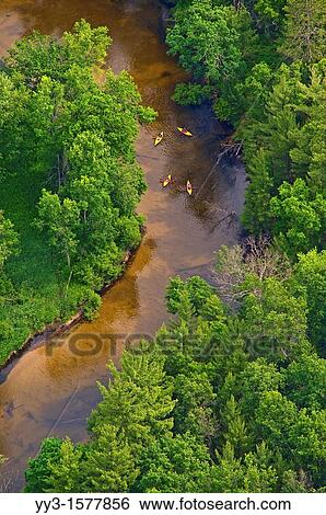Kayaks on the Pere Marquette river in Michigan The PM is a designated Wild and Scenic River by law View Large Photo Image Stock Photograph - Kayaks on the Pere Marquette river in Michigan The PM is a designated Wild and Scenic River by law. Fotosearch