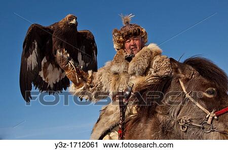 Kazak eagle hunters from far western province of Bayan Olgii compete in winter festival, Mongolia View Large Photo Image Stock Image - Kazak eagle hunters from far western province of Bayan Olgii compete in winter festival, Mongolia. Fotosearch