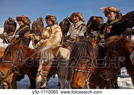 Kazak eagle hunters from far western province of Bayan Olgii compete in winter festival, Mongolia View Large Photo Image Stock Image - Kazak eagle hunters from far western province of Bayan Olgii compete in winter festival, Mongolia. Fotosearch