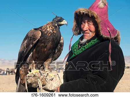 Kazakh eagle hunter and his golden eagle in the Altai Region of Bayan-? lgii in Western Mongolia View Large Photo Image Stock Image - Kazakh eagle hunter and his golden eagle in the Altai Region of Bayan-? lgii in Western Mongolia. Fotosearch