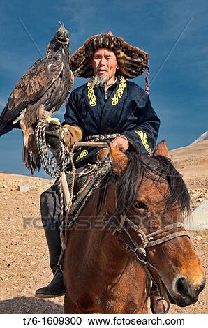 Kazakh eagle hunter and his golden eagle in the Altai Region of Bayan-? lgii in Western Mongolia View Large Photo Image Stock Image - Kazakh eagle hunter and his golden eagle in the Altai Region of Bayan-? lgii in Western Mongolia. Fotosearch