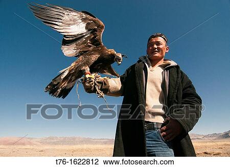 Kazakh eagle hunter and his golden eagle in the Altai Region of Bayan-? lgii in Western Mongolia View Large Photo Image Stock Image - Kazakh eagle hunter and his golden eagle in the Altai Region of Bayan-? lgii in Western Mongolia. Fotosearch