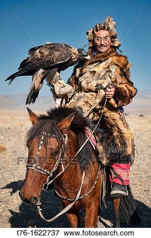 Kazakh eagle hunter and his golden eagle in the Altai Region of Bayan-? lgii in Western Mongolia View Large Photo Image Stock Photo - Kazakh eagle hunter and his golden eagle in the Altai Region of Bayan-? lgii in Western Mongolia. Fotosearch