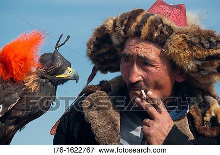 Kazakh eagle hunter and his golden eagle in the Altai Region of Bayan-? lgii in Western Mongolia View Large Photo Image Stock Photo - Kazakh eagle hunter and his golden eagle in the Altai Region of Bayan-? lgii in Western Mongolia. Fotosearch