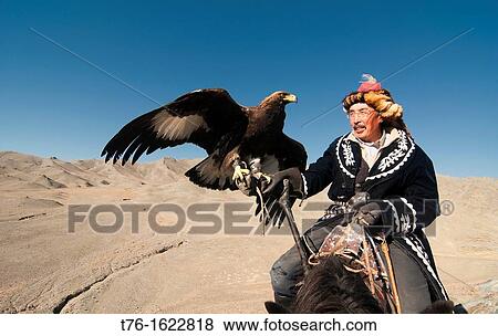 Kazakh eagle hunter and his golden eagle in the Altai Region of Bayan-? lgii in Western Mongolia View Large Photo Image Stock Photo - Kazakh eagle hunter and his golden eagle in the Altai Region of Bayan-? lgii in Western Mongolia. Fotosearch