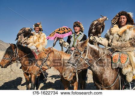 Kazakh eagle hunters and their golden eagles in the Altai Region of Bayan-? lgii in Western Mongolia View Large Photo Image Picture - Kazakh eagle hunters and their golden eagles in the Altai Region of Bayan-? lgii in Western Mongolia. Fotosearch