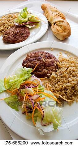Kebab of lamb with salad and brown rice and puff pastry bread View Large Photo Image Stock Image - Kebab of lamb with salad and brown rice and puff pastry bread. Fotosearch