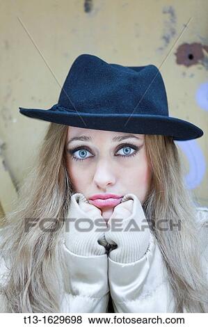 Keeping warm young woman portrait View Large Photo Image Stock Photo - Keeping warm young woman portrait. Fotosearch
