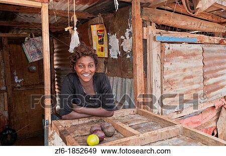 Kenya Africa Namanga, a border village with store and a great smileof a pretty woman black African poor town 3 View Large Photo Image Stock Photo - Kenya Africa Namanga, a border village with store and a great smileof a pretty woman black African poor town 3. Fotosearch