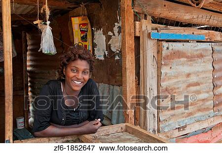 Kenya Africa Namanga border town fruit store and local woman with great smile in poor village 3 View Large Photo Image Stock Photo - Kenya Africa Namanga border town fruit store and local woman with great smile in poor village 3. Fotosearch