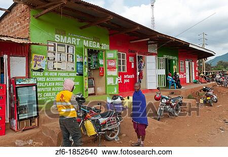 Kenya Africa Namanga border town stores and shops with local people in poor village View Large Photo Image Stock Image - Kenya Africa Namanga border town stores and shops with local people in poor village. Fotosearch