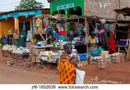 Stock Photo - Kenya Africa Namanga border town stores and shops with local people in poor village. Fotosearch