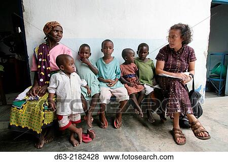KENYA. American Catholic missionary visiting poor people with HIV AIDS, Mombasa. View Large Photo Image Stock Photo - KENYA. American Catholic missionary visiting poor people with HIV AIDS, Mombasa.. Fotosearch