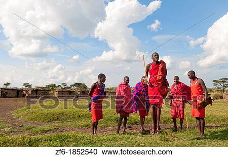Kenya Masai Mara Masai warriors doing traditional jumping for tourists in Masai Mara National Park in reserve 9 View Large Photo Image Stock Image - Kenya Masai Mara Masai warriors doing traditional jumping for tourists in Masai Mara National Park in reserve 9. Fotosearch