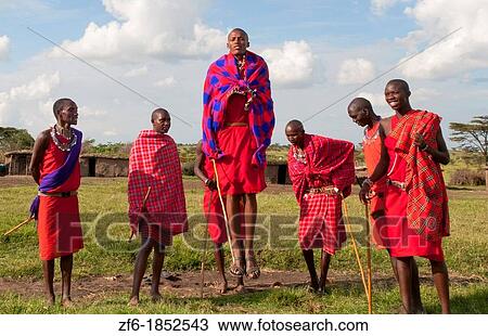 Kenya Masai Mara Masai warriors doing traditional jumping for tourists in Masai Mara National Park in reserve 9 View Large Photo Image Stock Image - Kenya Masai Mara Masai warriors doing traditional jumping for tourists in Masai Mara National Park in reserve 9. Fotosearch