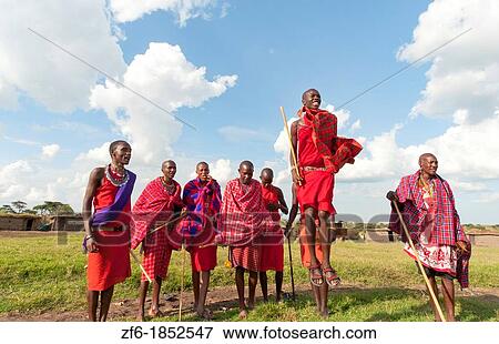 Kenya Masai Mara Masai warriors doing traditional jumping for tourists in Masai Mara National Park in reserve 9 View Large Photo Image Stock Photo - Kenya Masai Mara Masai warriors doing traditional jumping for tourists in Masai Mara National Park in reserve 9. Fotosearch