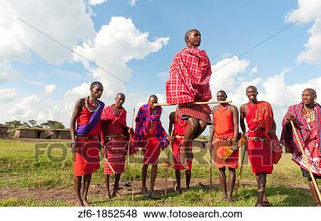 Kenya Masai Mara Masai warriors doing traditional jumping for tourists in Masai Mara National Park in reserve 9 View Large Photo Image Stock Photo - Kenya Masai Mara Masai warriors doing traditional jumping for tourists in Masai Mara National Park in reserve 9. Fotosearch