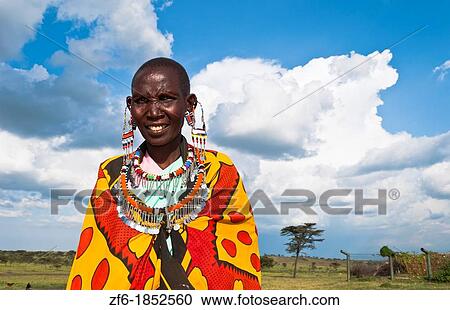 Kenya Masai Mara reserve with Masai woman in colorful dress with blue sky in Masai Mara National Park in reserve 10 View Large Photo Image Stock Image - Kenya Masai Mara reserve with Masai woman in colorful dress with blue sky in Masai Mara National Park in reserve 10. Fotosearch