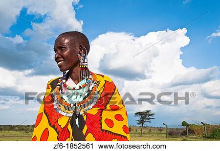 Kenya Masai Mara reserve with Masai woman in colorful dress with blue sky in Masai Mara National Park in reserve 10 View Large Photo Image Stock Image - Kenya Masai Mara reserve with Masai woman in colorful dress with blue sky in Masai Mara National Park in reserve 10. Fotosearch