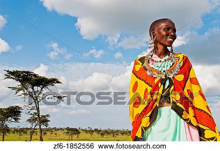Kenya Masai Mara reserve with Masai woman in colorful dress with blue sky in Masai Mara National Park in reserve 10 View Large Photo Image Stock Photograph - Kenya Masai Mara reserve with Masai woman in colorful dress with blue sky in Masai Mara National Park in reserve 10. Fotosearch