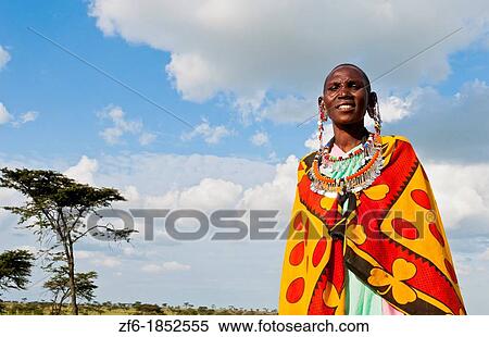 Kenya Masai Mara reserve with Masai woman in colorful dress with blue sky in Masai Mara National Park in reserve 10 View Large Photo Image Stock Photography - Kenya Masai Mara reserve with Masai woman in colorful dress with blue sky in Masai Mara National Park in reserve 10. Fotosearch