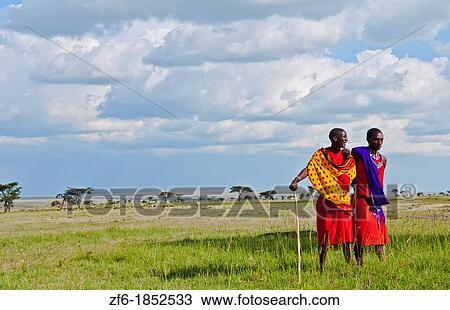 Kenya Masai Mara reserve with space and two Masai warriors and clouds in Masai Mara National Park in reserve 8 View Large Photo Image Stock Image - Kenya Masai Mara reserve with space and two Masai warriors and clouds in Masai Mara National Park in reserve 8. Fotosearch