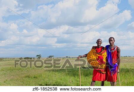 Kenya Masai Mara reserve with space and two Masai warriors and clouds in Masai Mara National Park in reserve 8 View Large Photo Image Stock Photo - Kenya Masai Mara reserve with space and two Masai warriors and clouds in Masai Mara National Park in reserve 8. Fotosearch