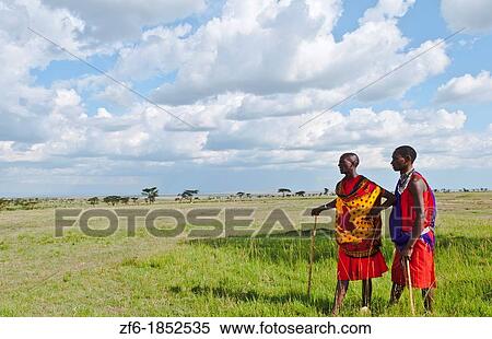 Kenya Masai Mara reserve with space and two Masai warriors and clouds in Masai Mara National Park in reserve 8 View Large Photo Image Stock Photography - Kenya Masai Mara reserve with space and two Masai warriors and clouds in Masai Mara National Park in reserve 8. Fotosearch